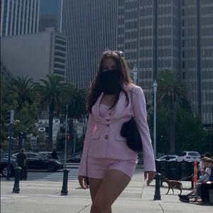 Three pieces of costume: shorts, top and jacket.